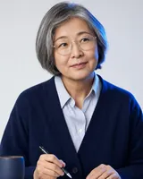 Portrait of Mei Lin, the fictional persona of the Improvement Agent, an AI agent